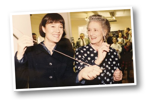Jean Bedells FRAD ex Principal Sadlers Wells Ballet with Alison cutting the ballet shoe ribbons to open the studio in 1995.